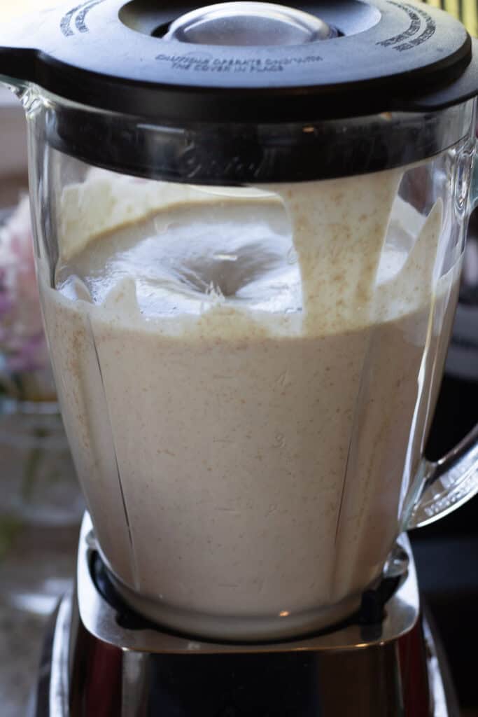 Blending pancake batter until smooth and creamy.