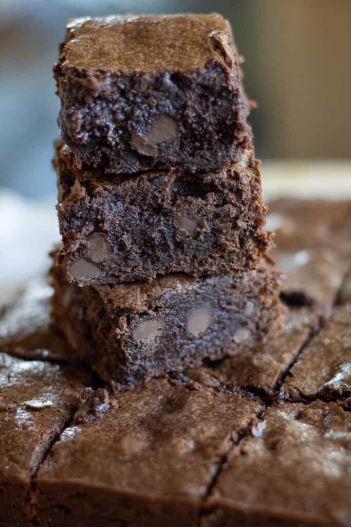 A stacked of baked fudgy sourdough brownies.